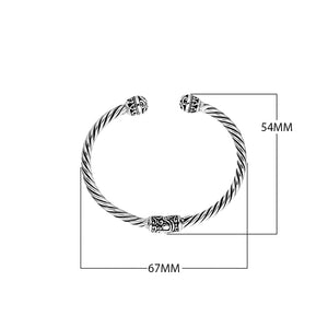 Wholesale sterling silver bangle with twisted rope design and Balinese motif ends, oxidized and polished finish, handcrafted in Bali.