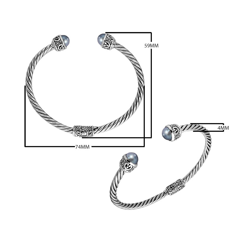 Wholesale sterling silver Gray Pearl bangle with twisted rope design, Balinese motifs, and oxidized finish, handcrafted in Bali.