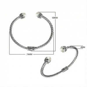 Wholesale sterling silver Pearl bangle with twisted rope design, oxidized finish, and Balinese motifs, handcrafted in Bali.