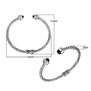 Sterling silver wholesale bangle with twisted rope design, Black Onyx and Cubic Zirconia accents, handcrafted Balinese motifs.