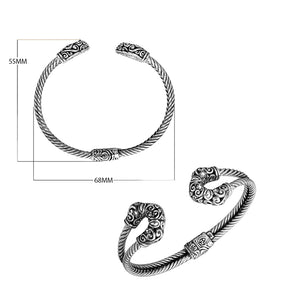 Sterling silver twisted bangle with cubic zirconia ends and Balinese carvings, handcrafted in Bali