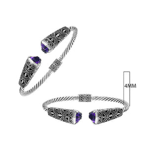 Sterling silver twisted bangle with amethyst quartz ends and oxidized Balinese design