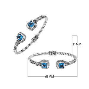 Sterling silver braided bangle with blue topaz quartz ends and Balinese oxidized design