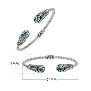 Silver twisted cable bangle in 925 sterling silver with Blue Topaz Quartz ends and Balinese engraving.