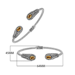 Silver twisted cable bangle in 925 sterling silver with Citrine Quartz ends and Balinese engraving.