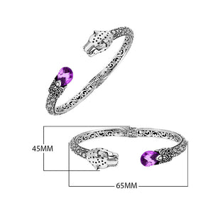 Sterling silver panther head cuff bangle with amethyst quartz ends and floral carvings handcrafted in Bali.