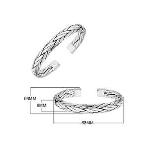 A wholesale sterling silver large woven bangle featuring bold Balinese textures, polished detailing, and a secure hinge lock, ideal for premium bulk jewelry purchasing.