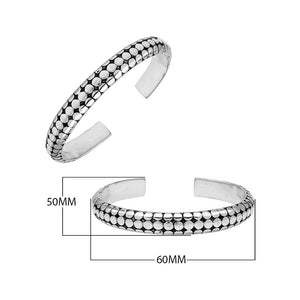 Sterling silver medium bangle featuring polished dot pattern detailing, oxidized accents, and a secure hinge lock crafted for reliable and stylish wholesale jewelry selections.