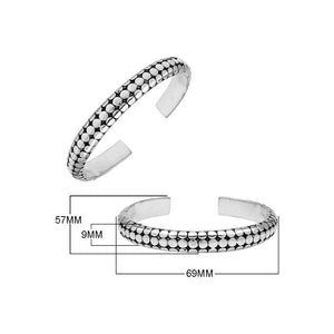 Sterling silver medium bangle featuring polished dot pattern detailing, oxidized accents, and a secure hinge lock crafted for reliable and stylish wholesale jewelry selections.
