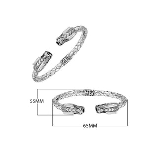 Wholesale sterling silver dragon head cuff bangle featuring detailed carvings, textured patterning, and a secure hinge-lock mechanism designed for reliable and consistent bulk inventory.