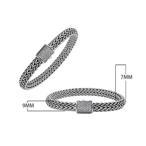 A wholesale sterling silver broad woven bracelet featuring a CVD Diamond-studded push clasp, polished and oxidized detailing, and bold craftsmanship designed for premium bulk jewelry collections.