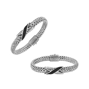 Sterling Silver woven bracelet featuring a polished push clasp and a Cubic Zirconia accented centerpiece, crafted with intricate detailing for durable and visually refined wholesale presentation.