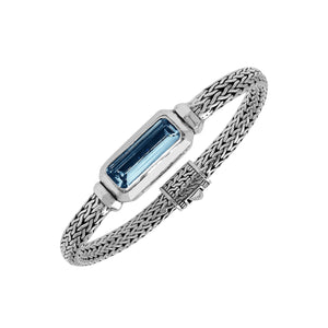 Sterling Silver woven bracelet featuring a polished push clasp and an elongated London Blue Topaz Quartz rectangular centerpiece, crafted with fine detailing for elegant and reliable wholesale presentation.