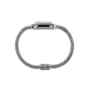 Wholesale sterling silver bracelet featuring a rectangular pink quartz baguette with a handwoven silver chain handcrafted in Bali.