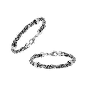 Sterling Silver bracelet featuring a twisted woven chain design with polished metal connectors and a secure lobster clasp, crafted for durable and elegant wholesale presentation.