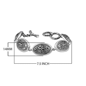 Sterling Silver oval link bracelet featuring detailed scroll pattern panels and a secure toggle lock, designed for wholesale buyers needing refined craftsmanship and durability.