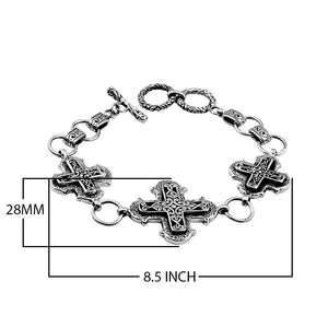 Sterling Silver bracelet featuring multiple cross-shaped links with detailed scroll patterns, polished edges, and a secure toggle lock for wholesale jewelry collections.