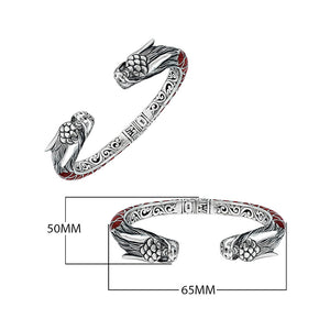 Wholesale sterling silver phoenix-inspired bangle featuring Red Coral accents, ornate Balinese scroll engraving, and a sturdy hinge lock for detailed, artisan-quality wholesale jewelry collections.