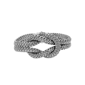 Wholesale sterling silver multi-strand woven knot bangle featuring a thick Balinese-style chain weave and a secure push clasp for premium artisan jewelry displays.
