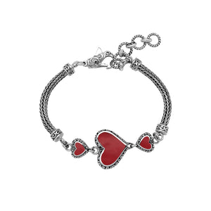 Wholesale sterling silver bracelet featuring Red Coral heart motifs, decorative Balinese detailing, and a secure lobster lock designed for premium artisan-inspired jewelry collections.