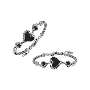 Wholesale sterling silver bracelet featuring Black Shell heart motifs, detailed Balinese ornamental scrollwork, and a secure lobster lock designed for artisan-inspired premium jewelry collections.