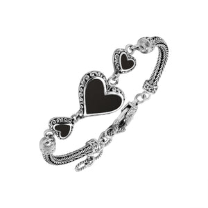 Wholesale sterling silver bracelet featuring Black Shell heart motifs, detailed Balinese ornamental scrollwork, and a secure lobster lock designed for artisan-inspired premium jewelry collections.