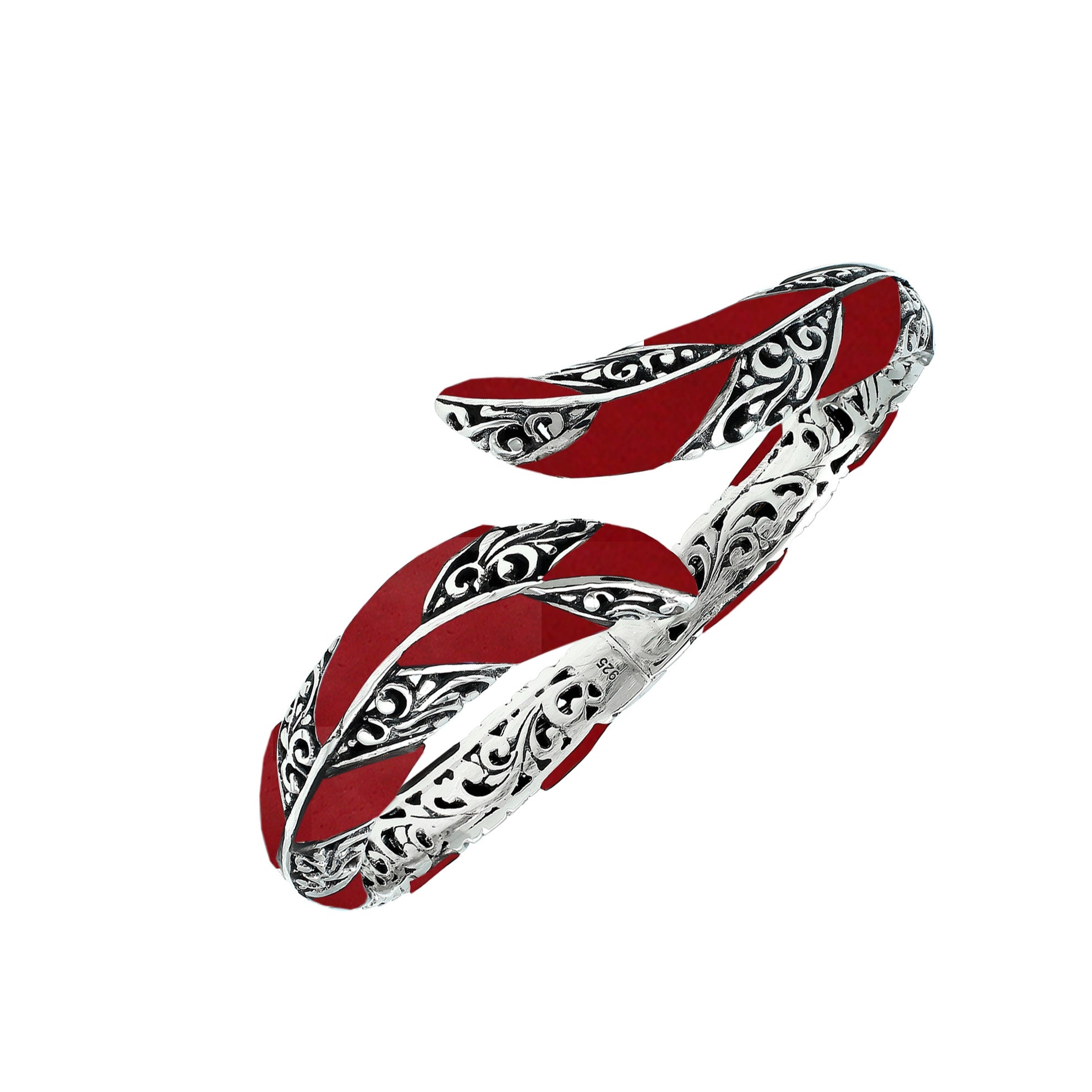 Wholesale sterling silver feather-inspired bangle featuring bold Red Coral inlays, ornate Balinese scroll engravings, and a secure hinge lock for premium artisan-style jewelry assortments.