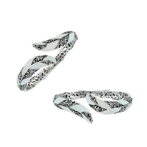 Wholesale sterling silver feather-inspired bangle featuring Mother Of Pearl inlays, ornate Balinese scroll engraving, and a secure hinge lock for premium artisan-style jewelry assortments.