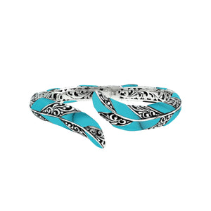 Wholesale sterling silver feather-style bangle featuring Turquoise Shell inlays, ornate Balinese scroll engravings, and a secure hinge lock for premium artisan jewelry assortments.