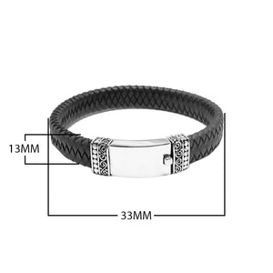 Wholesale sterling silver men’s bracelet featuring a smooth center plate, braided leather band, and secure push clasp crafted with detailed Bali-inspired accents.