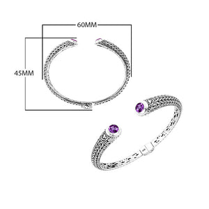 Wholesale sterling silver Bali engraved hinge cuff bracelet featuring amethyst quartz accents and polished–oxidized detailing, crafted for premium inventory and high-end wholesale jewelry buyers.