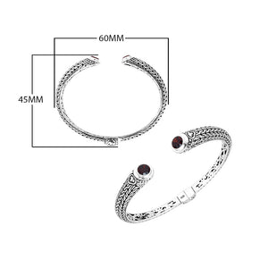 Wholesale sterling silver Bali engraved hinge cuff bracelet featuring deep red garnet quartz accents with polished–oxidized detailing, ideal for premium bulk jewelry inventory selections.