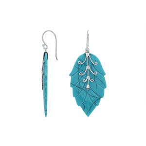 Sterling silver turquoise shell carved leaf drop earrings with polished silver detailing and handcrafted stone design.