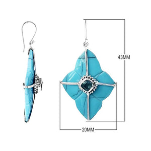 Sterling silver Turquoise Shell and Blue Topaz Quartz dangle earrings with geometric blue inlay panels, faceted centers, and radiating silver framework