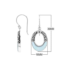 Sterling silver oval drop earrings featuring luminous Mother Of Pearl inlay, open center silhouette, decorative scrollwork, oxidized detailing, polished borders, and French ear wires.