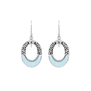 Sterling silver oval drop earrings featuring luminous Mother Of Pearl inlay, open center silhouette, decorative scrollwork, oxidized detailing, polished borders, and French ear wires.