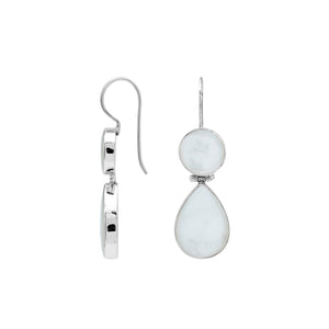 Sterling silver Mother Of Pearl dangle earrings featuring round and teardrop shell elements, polished bezel settings, articulated construction, and elegant elongated ear wires.