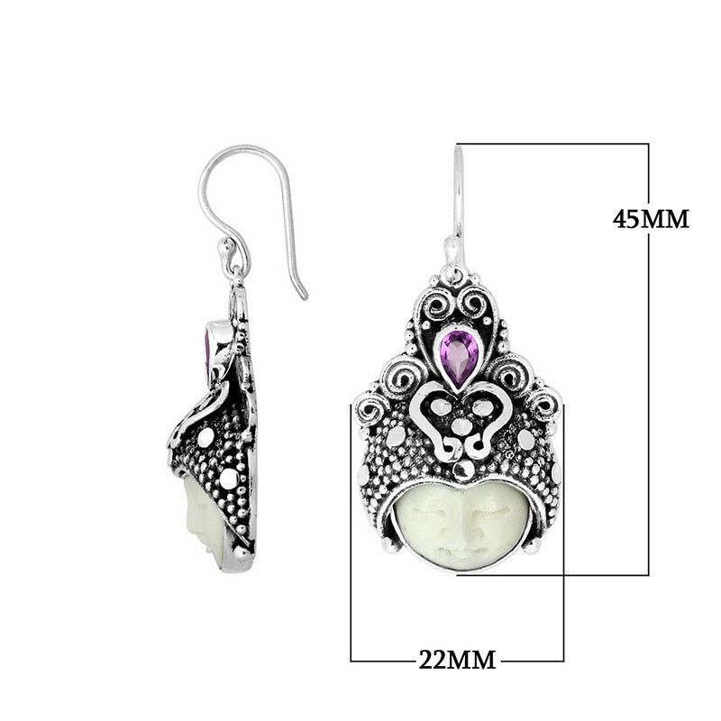 Wholesale sterling silver ornate headdress earrings with carved bone face and Amethyst Quartz accent.