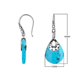 Wholesale-ready sterling silver earrings featuring Turquoise Shell drops set in a structured polished teardrop frame.