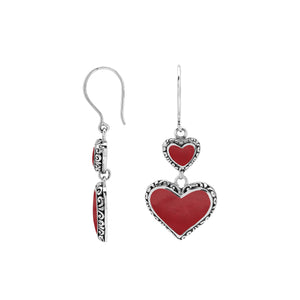 Wholesale sterling silver earrings featuring double red coral heart drops with ornate borders, crafted to deliver consistent artisan quality and strong catalog-ready appeal for bulk jewelry purchasers.