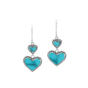 Wholesale sterling silver earrings featuring double turquoise shell hearts with ornate decorative borders, crafted to deliver consistent artisan quality and strong catalog-ready appeal for bulk jewelry buyers.
