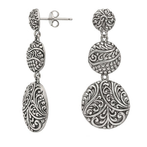 Sterling silver triple drop earrings with polished oval design and artisan detailing