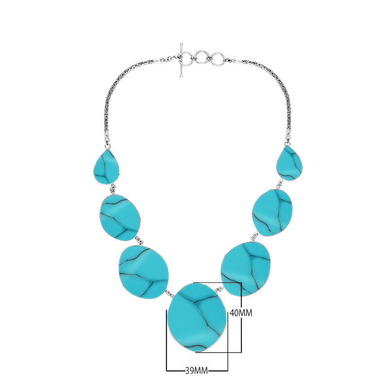 Sterling silver necklace with oval and teardrop turquoise shell links, polished artisan finish.