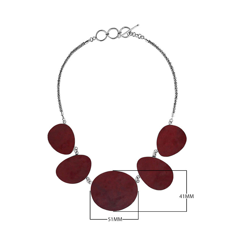 Sterling silver necklace with oval red coral links, polished artisan finish.