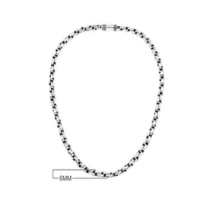 Sterling silver round box link chain necklace featuring substantial interlocking links, polished surfaces, oxidized recessed details, and a streamlined decorative push clasp.