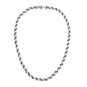 Sterling silver round box link chain necklace featuring substantial interlocking links, polished surfaces, oxidized recessed details, and a streamlined decorative push clasp.