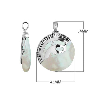 Sterling silver round pendant with luminous Mother of Pearl inlay and artistic silver overlay design, handcrafted Bali jewelry available for wholesale purchase.