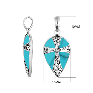 Wholesale sterling silver teardrop pendant with turquoise shell inlay and ornate cross design, handcrafted in Bali – artisan bulk jewelry for boutiques and resellers.
