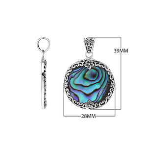 Wholesale sterling silver round pendant with abalone shell inlay and floral scroll accents, handcrafted Bali artisan jewelry for bulk buyers.