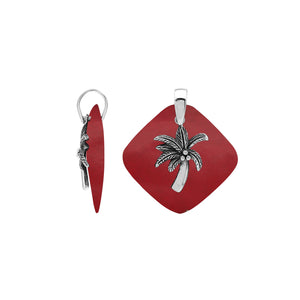Sterling silver palm tree pendant on coral diamond-shaped base, handmade in Bali for wholesale jewelry buyers.